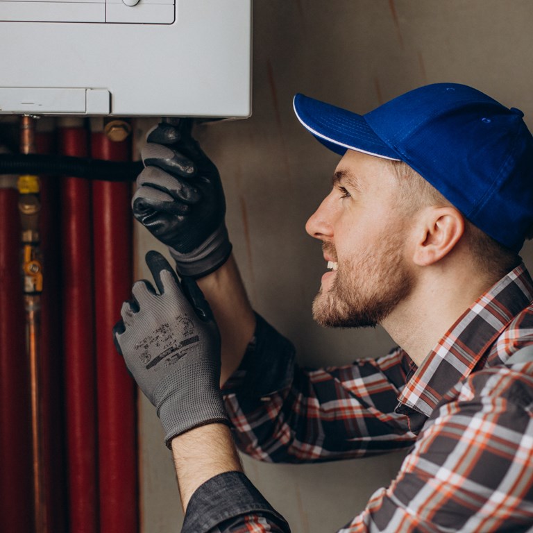 25 Service Man Adjusting House Heating System